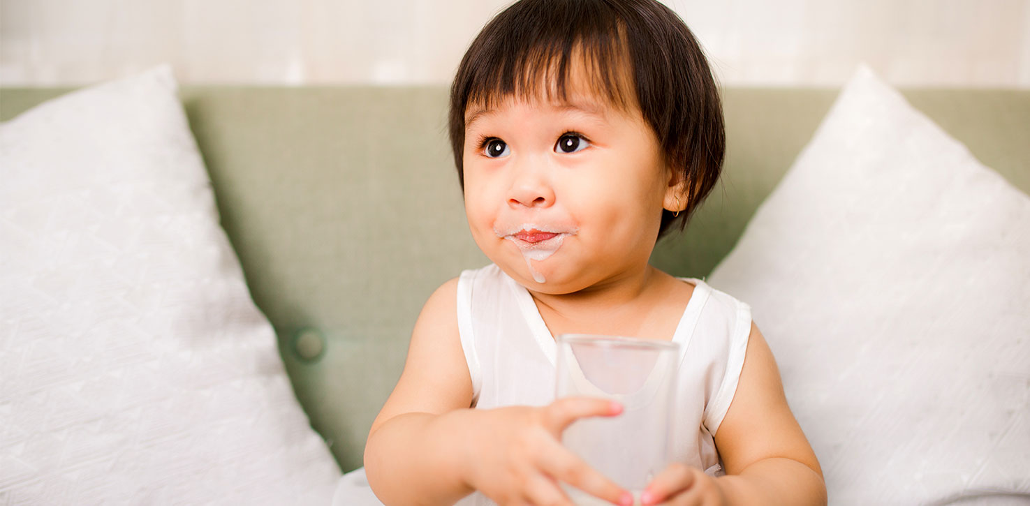 child with milk image